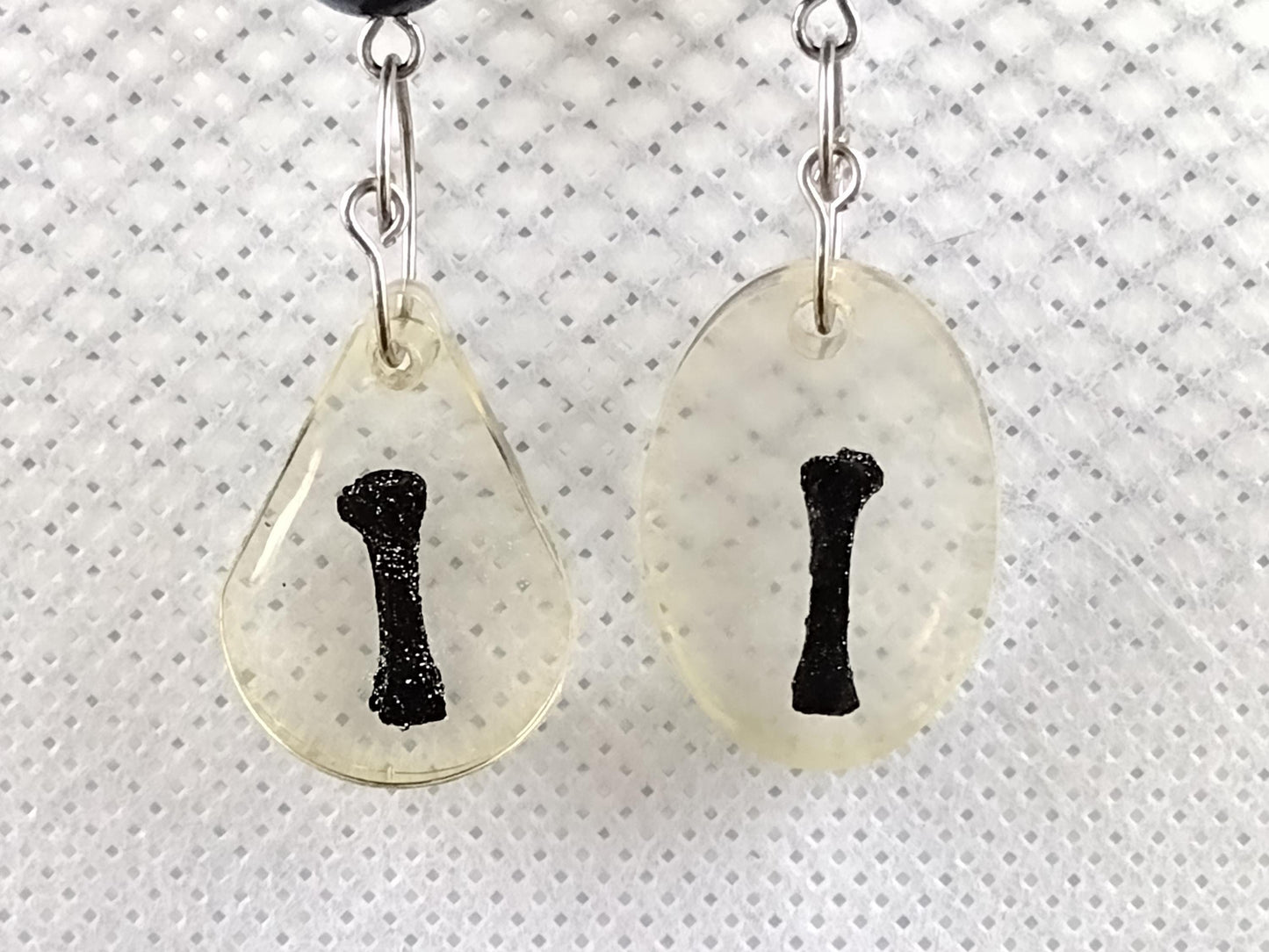 Long resin-encased bone earrings