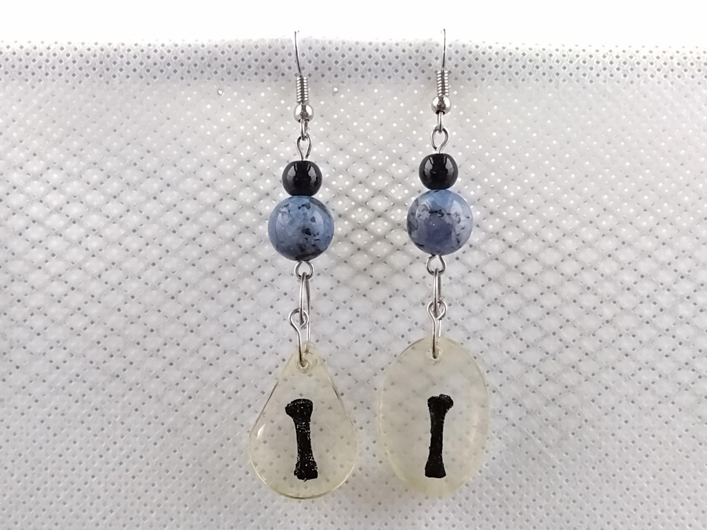 Long resin-encased bone earrings