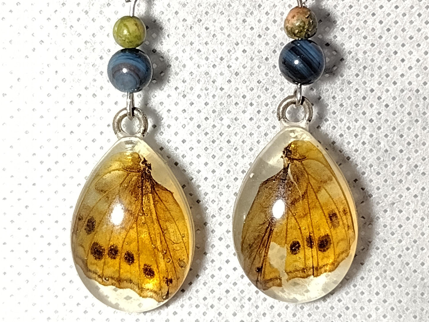 Long butterfly wing resin earrings