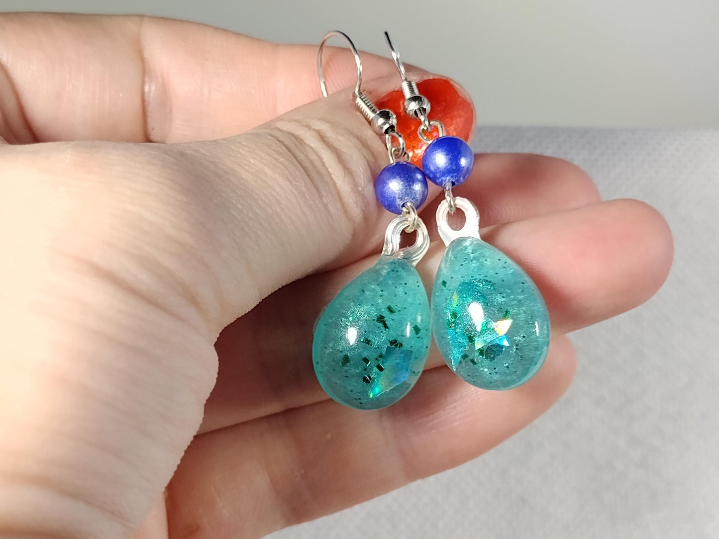Blue resin earrings with holographic foil