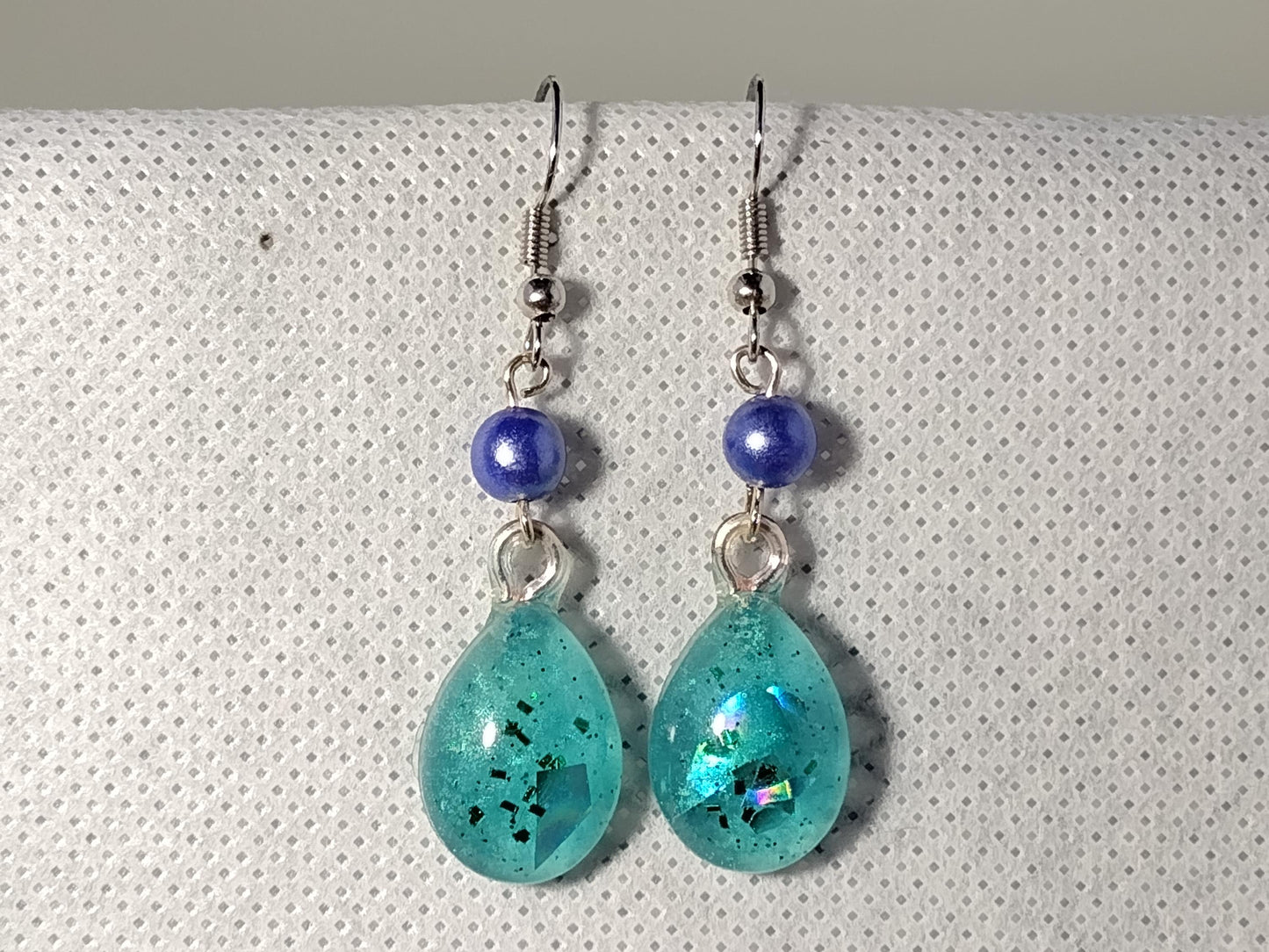 Blue resin earrings with holographic foil